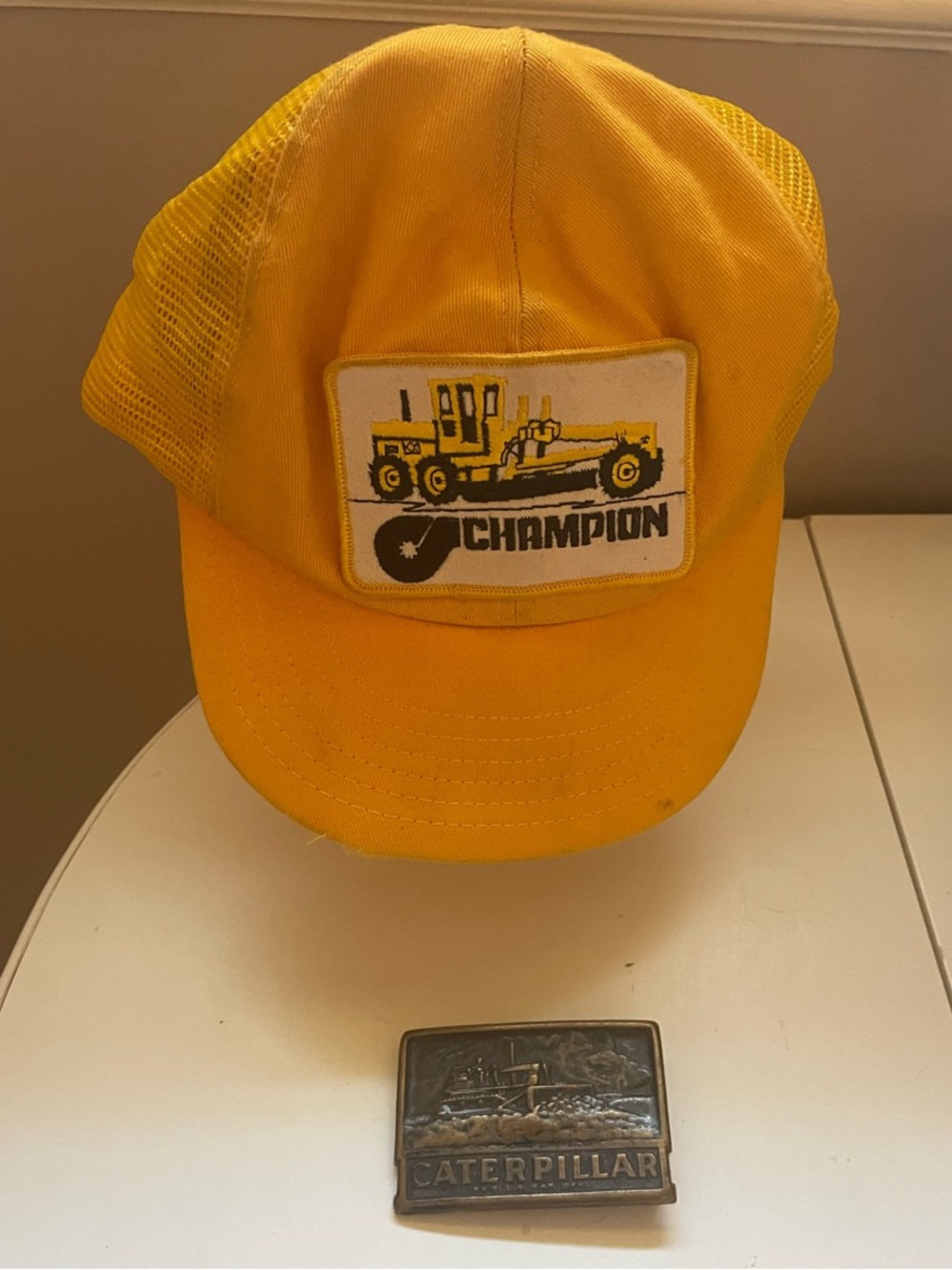 Vtg Caterpillar cap, Bronze Belt Buckle raised image of Machinery with logo